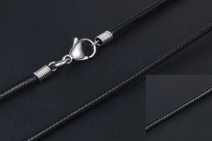 Close-up of black braided cord necklace featuring a silver metal lobster clasp and texture