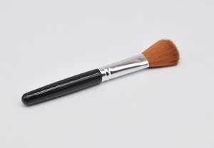 Macro detail of soft brown bristles and polished silver ferrule on a blush brush