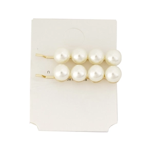 Pair of elegant white pearl hair clips with gold alloy base on a white display card