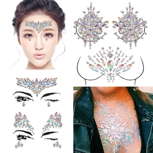 Macro detail of iridescent rhinestone face and chest gems for festival makeup looks