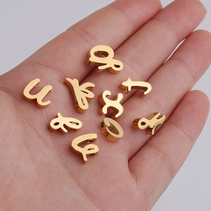 Golden mirror finish stainless steel alphabet beads for DIY jewelry making in palm