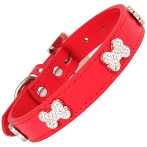Red leather pet collar with rhinestone bone charms and silver metal buckle on white background