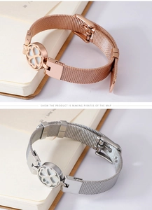 Detail of mesh strap bracelets in rose gold and silver with clover cutout charms