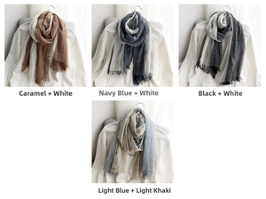Detailed texture of lightweight cotton-linen scarves with natural fringe in various colors