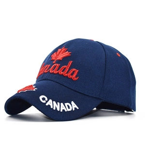 Close-up of Canada embroidery and maple leaf detail on the side of navy baseball cap