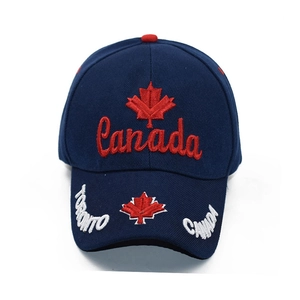 Detail of red Canada embroidery and Toronto text on navy blue cotton baseball cap