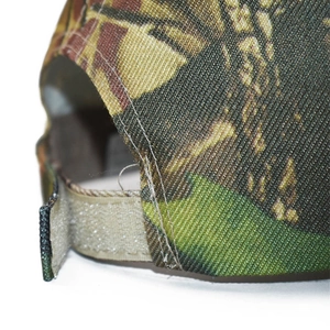Camo baseball cap featuring durable jungle pattern fabric and adjustable strap detail