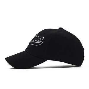 Black baseball cap with white Vegas embroidery in a side-view profile on white background