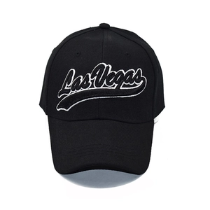 Detailed close-up of white 3D Las Vegas embroidery on black twill baseball cap