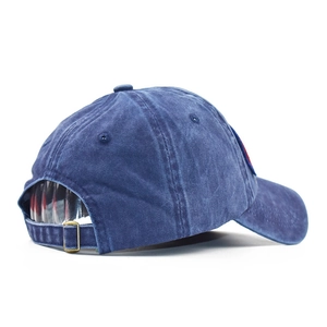Detail view of the vintage washed navy cotton baseball cap with adjustable metal buckle