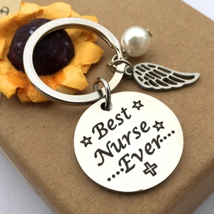 Porte-clés en acier Best Nurse Ever avec perle et aile d'ange pour cadeau infirmier