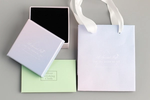 Pink and blue gradient jewelry gift set with matching bag and silver polishing cloth