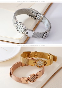 Macro detail of heart-shaped clover mesh watch band bracelets in silver, gold, and rose gold