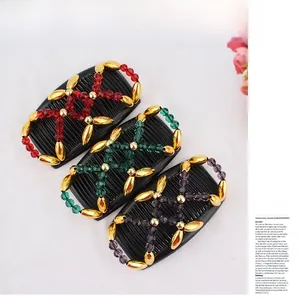 Detail view of three beaded magic hair combs in red, green, and purple vintage style