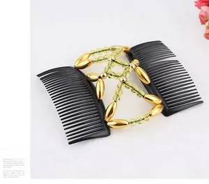 Detail of magic hair comb with gold oval beads and yellow faceted crystals on black combs