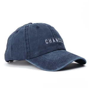 Detail of CHANCE embroidery on navy blue washed cotton vintage baseball cap