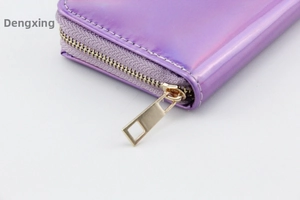 Detail of holographic laser PU purple long wallet showing golden zipper and neat stitching