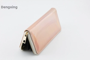 Detail of rose gold holographic PU leather long wallet with high-shine metallic finish