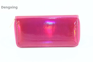 Macro view of hot pink iridescent PU leather long wallet with white stitching and metal zipper