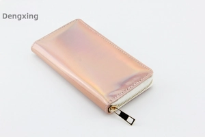 Detailed view of long iridescent laser PU leather wallet with gold metal zipper and stitching
