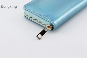 Close-up of light blue laser PU long wallet showing golden zipper detail and texture