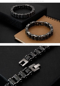 Detailed close-up of dark stainless steel bike chain bracelet and secure clasp mechanism