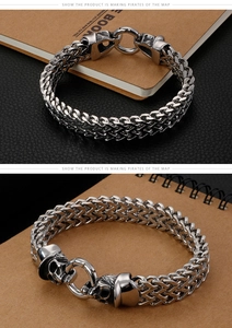 Macro shot of punk steel skull clasp and Franco weave chain on leather background