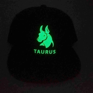 Luminous Taurus zodiac baseball cap with green glow-in-the-dark flat brim in black
