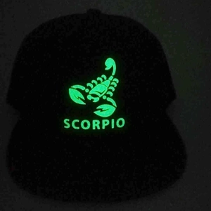 Luminous Scorpio baseball cap in black with glowing zodiac pattern and English text