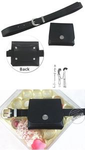 Detail view of black faux leather waist belt with detachable mini pouch and silver buckle