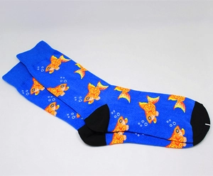 Detail of creative knit mid-calf socks featuring orange goldfish patterns on bright blue base