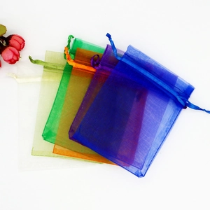 Colorful organza drawstring gift bags in multiple shades for jewelry and favors