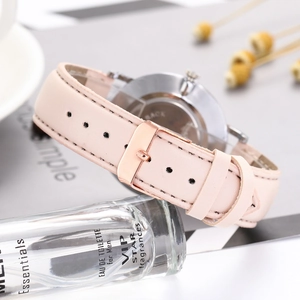 Pink leather strap business watch for women with rose gold buckle and minimalist dial