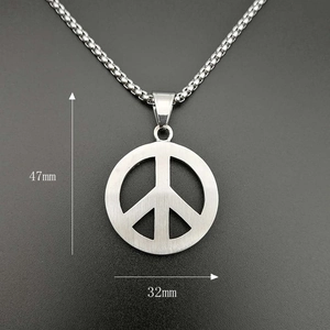 Detailed view of the gold-plated peace sign pendant with dimensions 32mm by 47mm