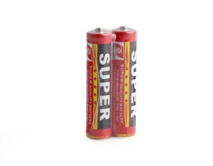 Detail of two AAA 1.5V batteries in red and gold finish under transparent film wrap