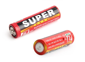 Detail view of 1.5V AA R6 super quality batteries with red and black industrial design