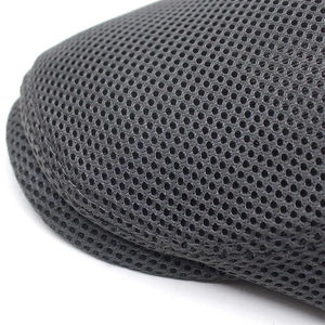 Close-up of breathable dark grey mesh fabric on a lightweight summer beret hat