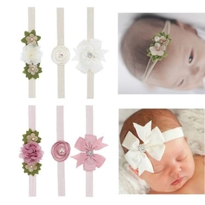 Detail set of assorted newborn floral and bow headbands with baby model wearing examples