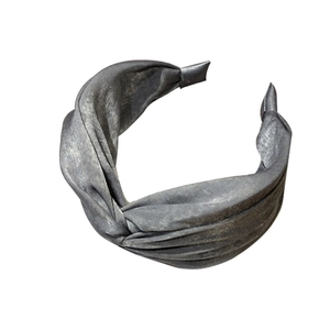 Deep grey silk fabric wide headband featuring a stylish twisted knot design on white background