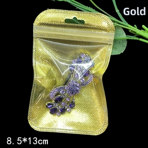 Detailed view of purple crystal jewelry in an 8.5x13cm gold resealable packaging bag