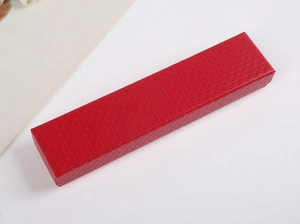 Detailed view of long red jewelry gift box featuring elegant rhombus textured pattern