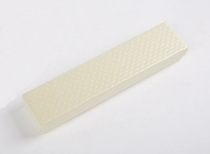 Detail of light gold jewelry box featuring a refined diamond grid pattern for necklaces