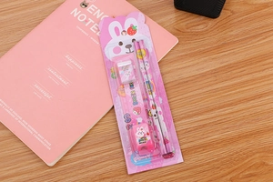Pink stationery set with pencils, ruler, eraser and sharpener in rabbit themed packaging