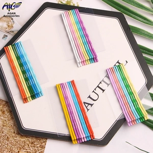 Set of colorful wave-shaped metal hair clips in bright candy colors on display