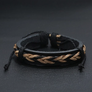 Retro black woven leather bracelet with brown cord detail on a dark textured surface