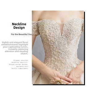 Detail of off-the-shoulder neckline on luxury champagne wedding dress with sequins