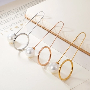 Elegant long pearl safety pin brooch set in gold, rose gold, and silver finishes
