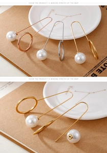 Detailed view of elegant long pearl drop earrings in gold, rose gold and silver finishes