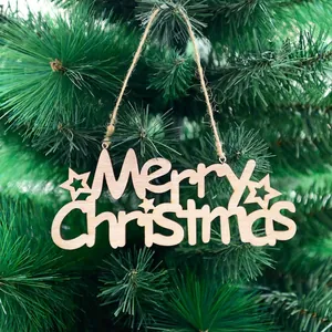 Wooden Merry Christmas hanging sign with hollow star design on a green Xmas tree branch