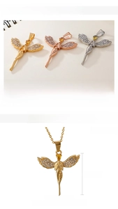 Macro detail of angel wing pendants with white and yellow zircons in three metallic finishes